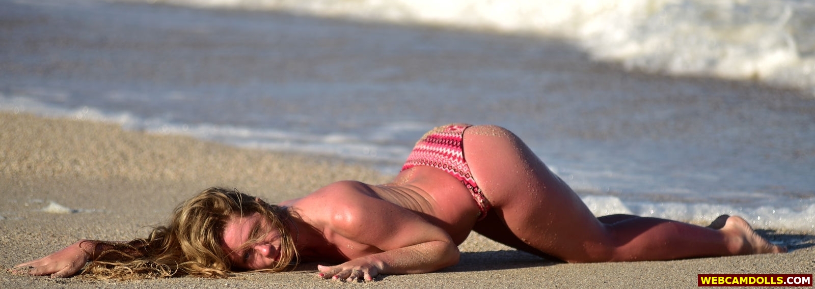 Blonde Girl laying on Sand wearing only Bikini Bottom on Webcamdolls