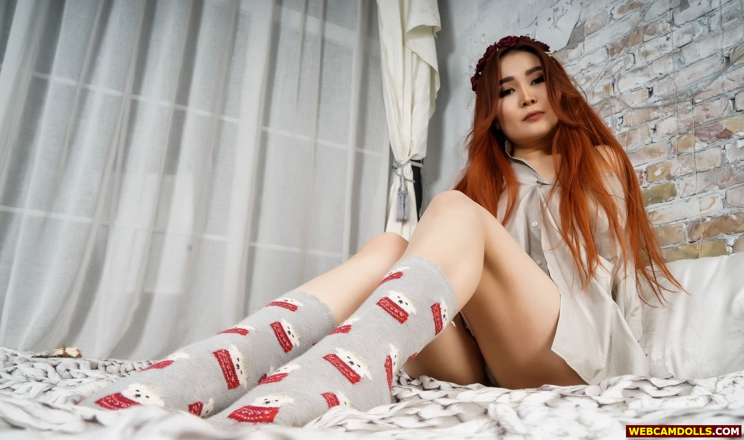 Redhead Asian Girl in Grey Shirt and Colored Socks on Webcamdolls
