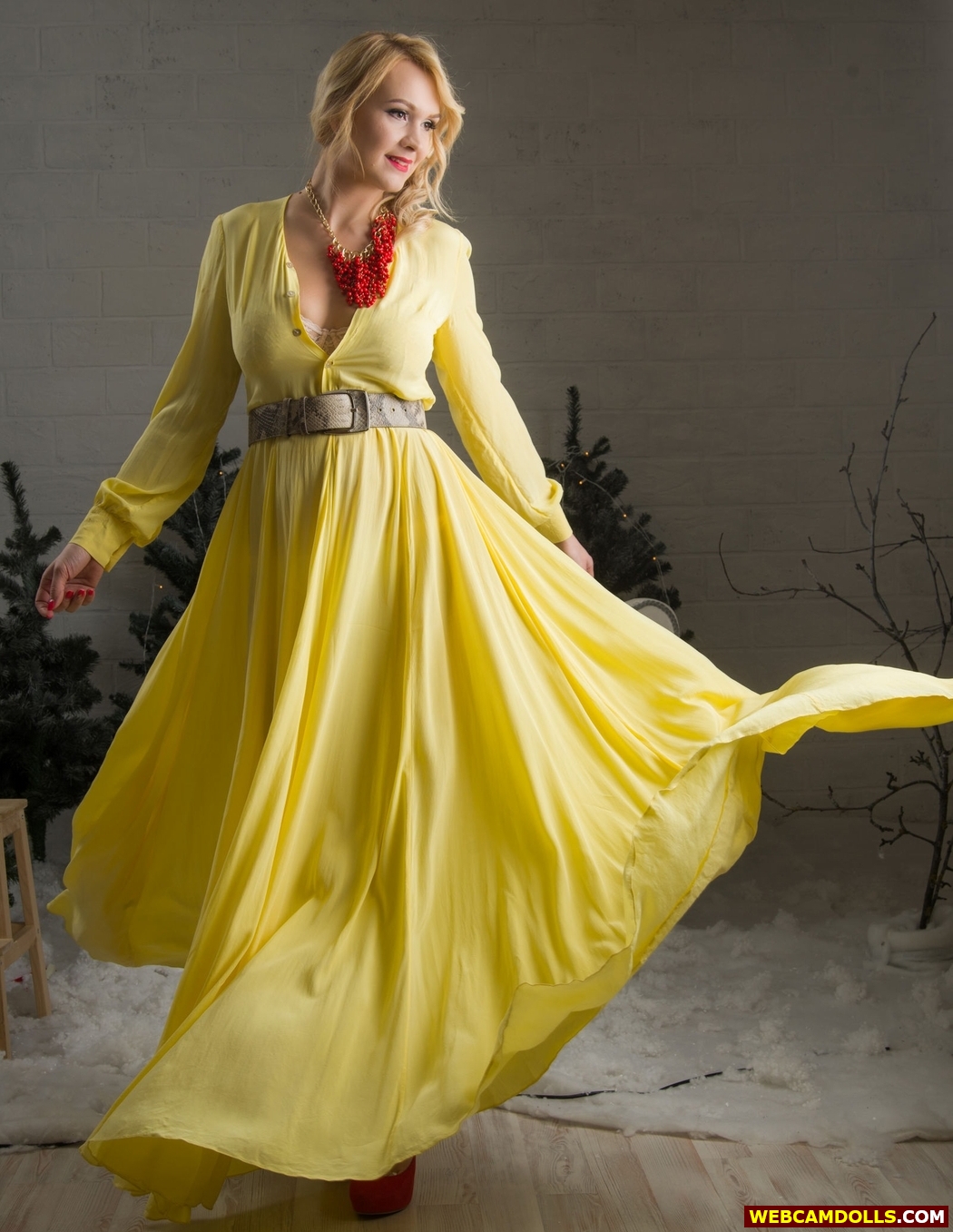 Blonde MILF wearing Lace Bra under Yellow Long Dress on Webcamdolls