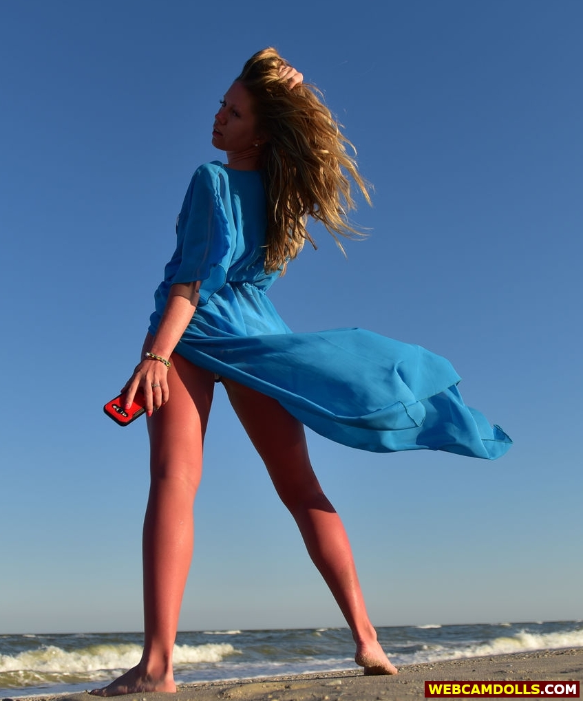 Blonde Girl showing Bare Legs and Feet in Blue Long Dress on Webcamdolls