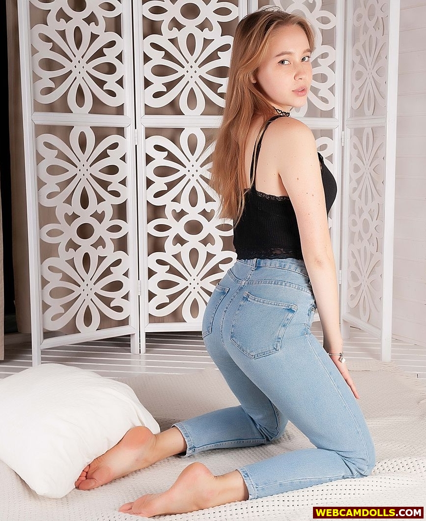 Blonde Teenage Girl showing Bare Feet Soles in Tight Blue Denim Jean on Webcamdolls