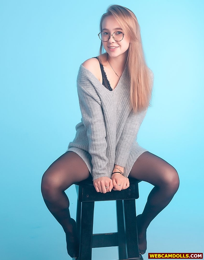 Blonde Teen Girl in Sheer Nylon Pantyhose and Grey Woollen Sweater on Web Camdolls