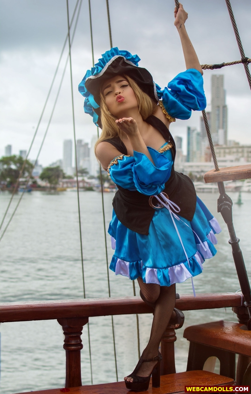 Blonde Pirate Girl in Black Fishnet Pantyhose and Blue Short Dress on Webcamdolls